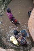 The water is retrieving from 10m deep well by men-chain to small reservoir. Men are singing for better synchronization. Singing well, Dublock. Ethiopia.