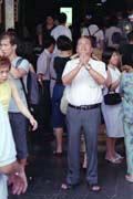 Praying. Singapore.