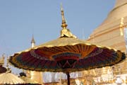 Umbrella is used for decoration and sun protection too. Novitiation ceremony at Shwedagon Paya, Yangon. Myanmar (Burma).