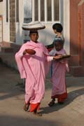 Monks are going through the village each morning. They are gathering the rice for the whole day. Nyaung U. Myanmar (Burma).