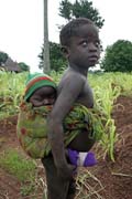 Children from Somba tribe (also called Betamarib� people). Older child must take care of younger siblings. Boukoumb� area. Benin.