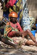 Woman at Tourou village at Mandara Mountains. Local fashion is red wooden calabashes on women' heads. They look rather like army helmets and which indicate things like their marital status. Cameroon.