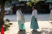 Priests near shrine at Fukuoka. Japan.