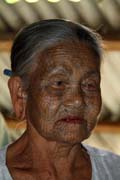 Woman from Chin tribe, Mrauk U area. Women have tradtionaly tattooed their faces. Myanmar (Burma).