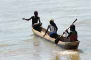 Local villagers in pirogue at Tsiribihina river. Madagascar.