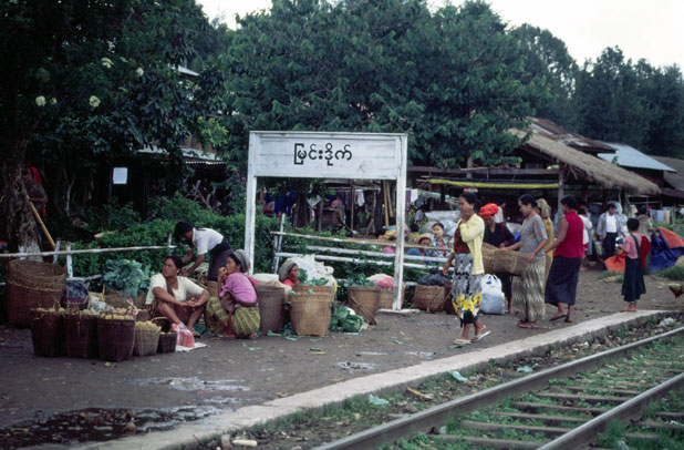 Railway station. People waits for train. They want to sell their products to traders at train. Area around Kalaw village. Myanmar (Burma).