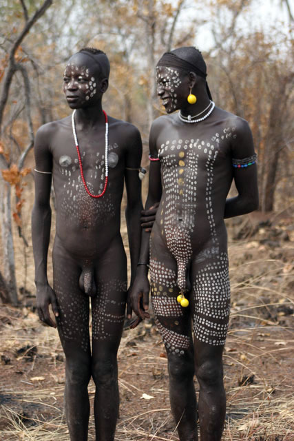 Mursi men. South,  Ethiopia.