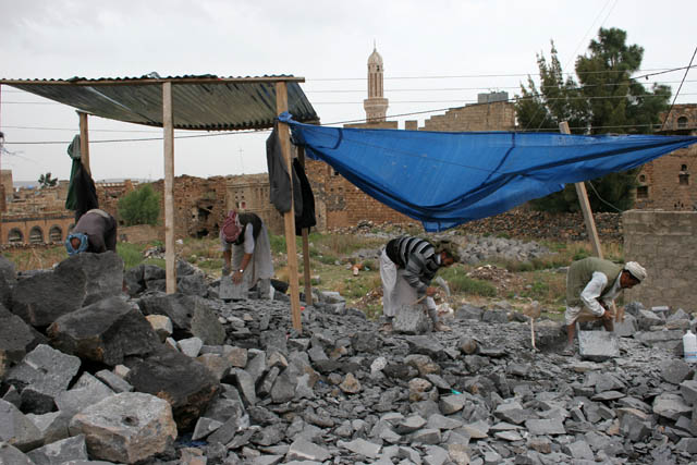 Stonemasons at Shibam-Kawkaban village. Yemen.