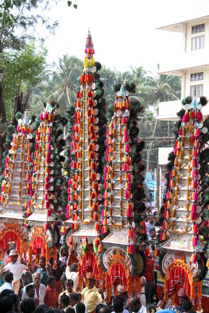 Thaipooya Mahotsavam Festival and ambalakkavadi - decorated model of a temple which a male devotee carries on his shoulders. Sree Maheswara Temple at Koorkancheri in the Thrissur town at Kerala. India.